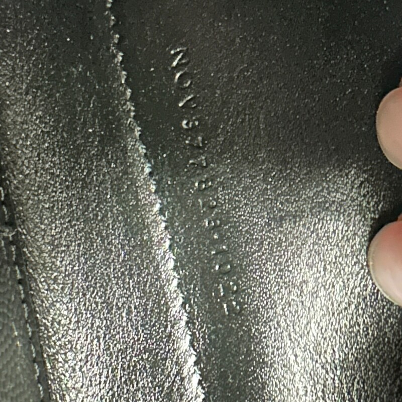 Saint Laurent  Cassandre Grained Wallet On A Chain<br />
<br />
Serial Code: NOV377828.1022<br />
<br />
Dimensions: 5.5H x 9W x 1.5D<br />
<br />
In very good condition. Light hardware scratches.<br />
<br />
Comes with the original dust bag and box.