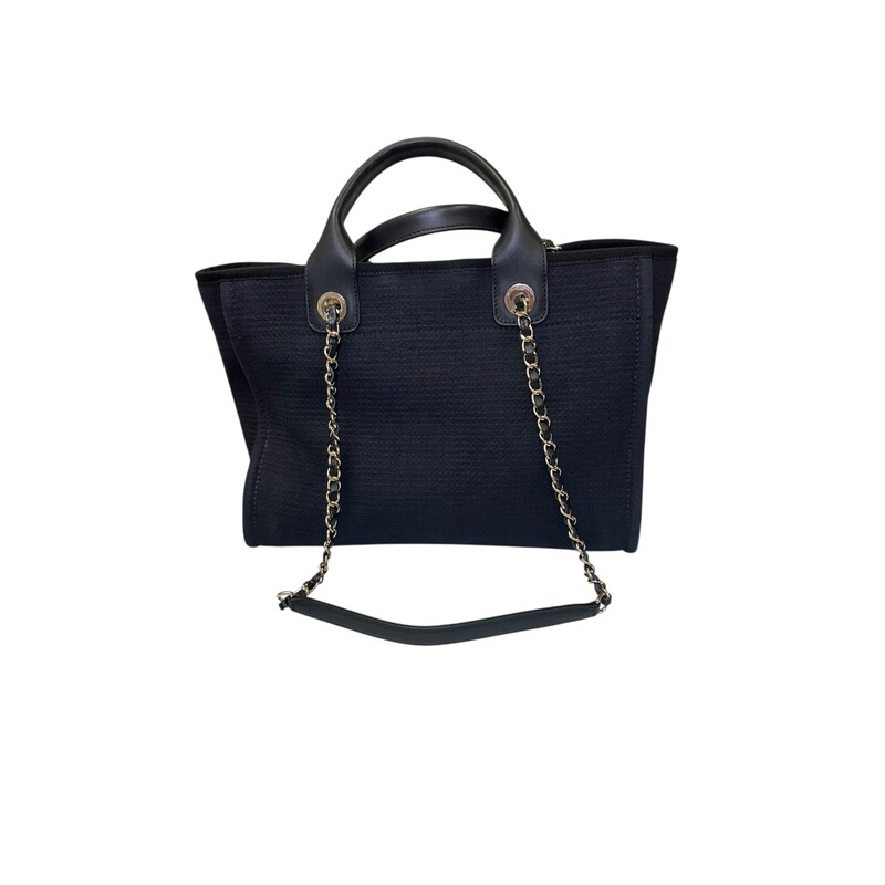 Chanel Deauville Mixed Canvas Small Tote<br />
<br />
Date Code: EE******<br />
<br />
Dimensions:<br />
Base length: 12.75 in<br />
Height: 9.75 in<br />
Width: 6.00 in<br />
Drop: 3.75 in<br />
Drop: 12.00 in<br />
<br />
In excellent condition. Light scuffing under the handels.<br />
<br />
Comes with the original dust bag.