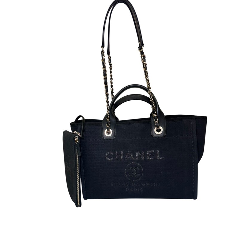 Chanel Deauville Mixed Canvas Small Tote<br />
<br />
Date Code: EE******<br />
<br />
Dimensions:<br />
Base length: 12.75 in<br />
Height: 9.75 in<br />
Width: 6.00 in<br />
Drop: 3.75 in<br />
Drop: 12.00 in<br />
<br />
In excellent condition. Light scuffing under the handels.<br />
<br />
Comes with the original dust bag.