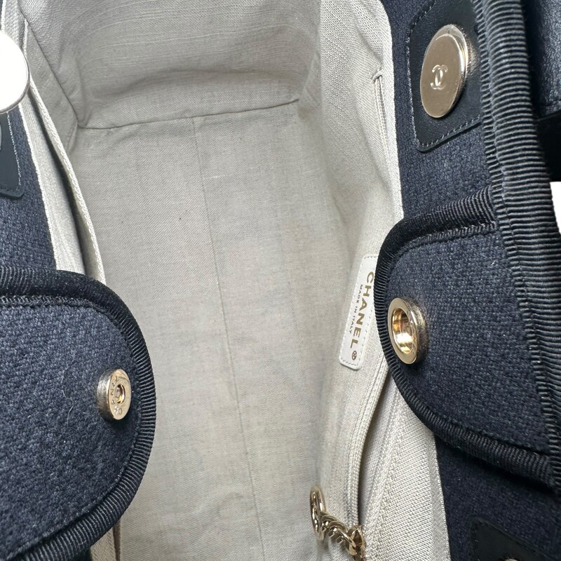 Chanel Deauville Mixed Canvas Small Tote<br />
<br />
Date Code: EE******<br />
<br />
Dimensions:<br />
Base length: 12.75 in<br />
Height: 9.75 in<br />
Width: 6.00 in<br />
Drop: 3.75 in<br />
Drop: 12.00 in<br />
<br />
In excellent condition. Light scuffing under the handels.<br />
<br />
Comes with the original dust bag.