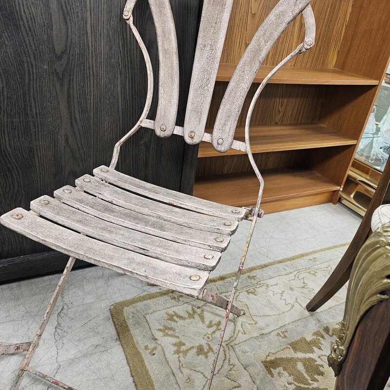 Pair Antique French Bistro Chairs<br />
Distressed Iron<br />
Foldable<br />
Size: 38 Inches