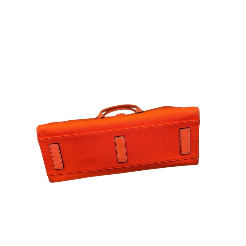 Versace La Medusa Canvas Orange Tote<br />
<br />
Dimensions: 15 L X 12 H inches<br />
<br />
In very good condition. Some faint marks on the canvas, interior marks and corner wear.<br />
<br />
Does not come with original dust bag or box,
