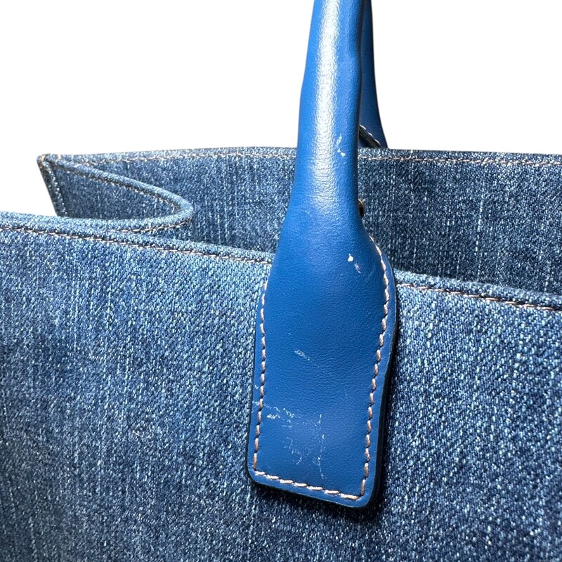Versace La Medusa Denim Tote<br />
<br />
Dimensions: 15 L X 12 H inches<br />
<br />
In good condition. Minor stain on the front of the bag and minor corner wear.<br />
<br />
Does not come with original dust bag or box.