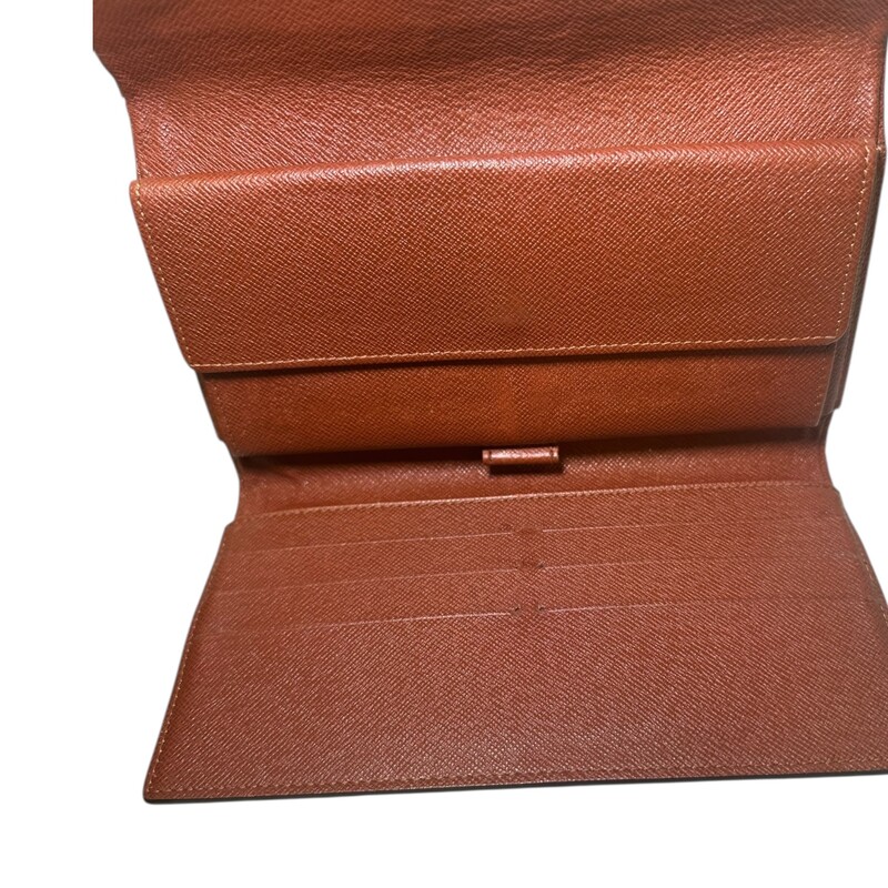 Louis Vuitton Monogram Wallet<br />
<br />
Date Code:MB0011<br />
<br />
Dimensions: 7 L x 5 H inches<br />
<br />
In very good condition. Some minor puckering of the canvas.<br />
<br />
Does not come with original dust bag or box.