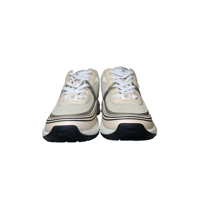 Chanel Fabric Laminated Calfskin Stretch CC Sneakers Ivory White Silver 23A G45077B13308<br />
<br />
Size 37.5<br />
<br />
Code: W G45077<br />
<br />
In excellent condition. New in Box.<br />
<br />
Comes with the original dust bag and box.