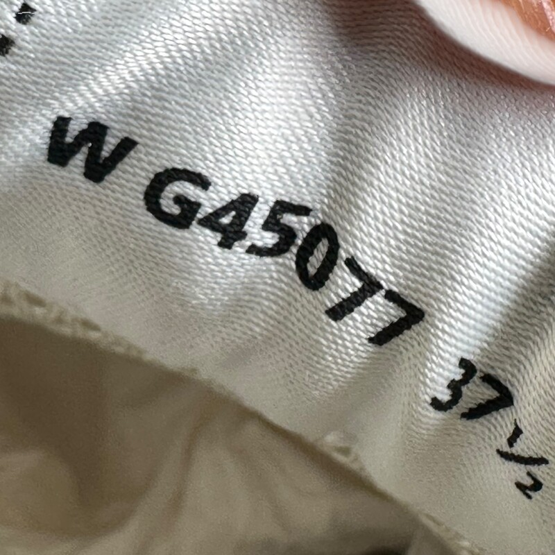 Chanel Fabric Laminated Calfskin Stretch CC Sneakers Ivory White Silver 23A G45077B13308<br />
<br />
Size 37.5<br />
<br />
Code: W G45077<br />
<br />
In excellent condition. New in Box.<br />
<br />
Comes with the original dust bag and box.