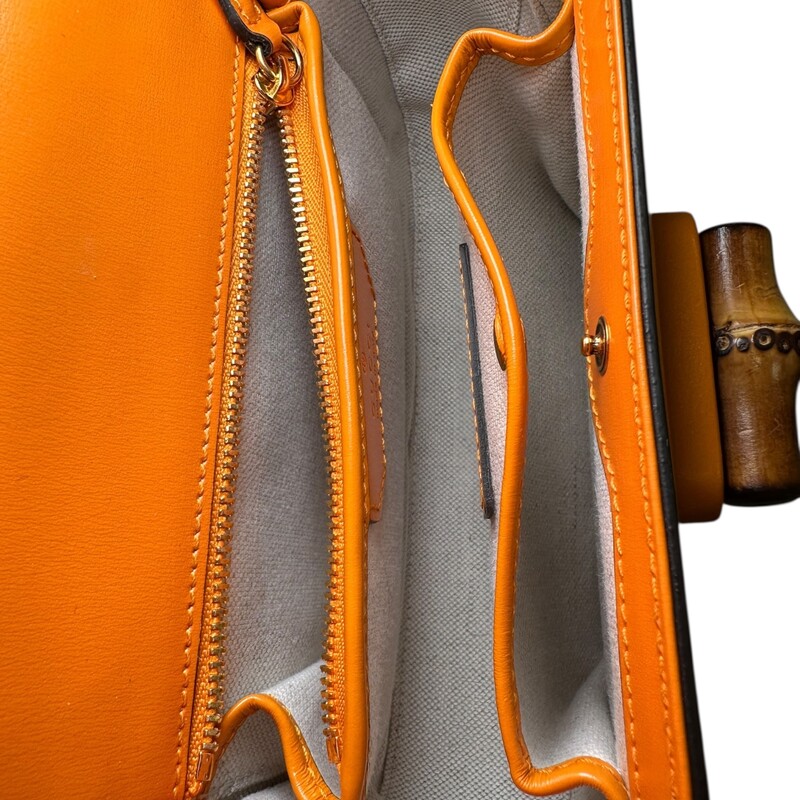 Gucci Bamboo 1947 Top Handle Orange Small<br />
<br />
Syle Code: 675797 498879<br />
<br />
Dimensions:<br />
Length: 8.25 in<br />
Height: 6 in<br />
Width: 2.75 in<br />
Drop: 4.25 in<br />
Drop: 22 in<br />
Drop: 21.75 in<br />
<br />
In excellent condition. Does not come with the leather strap, comes with the web canvas strap.<br />
<br />
Does not come with the original dust bag or box.