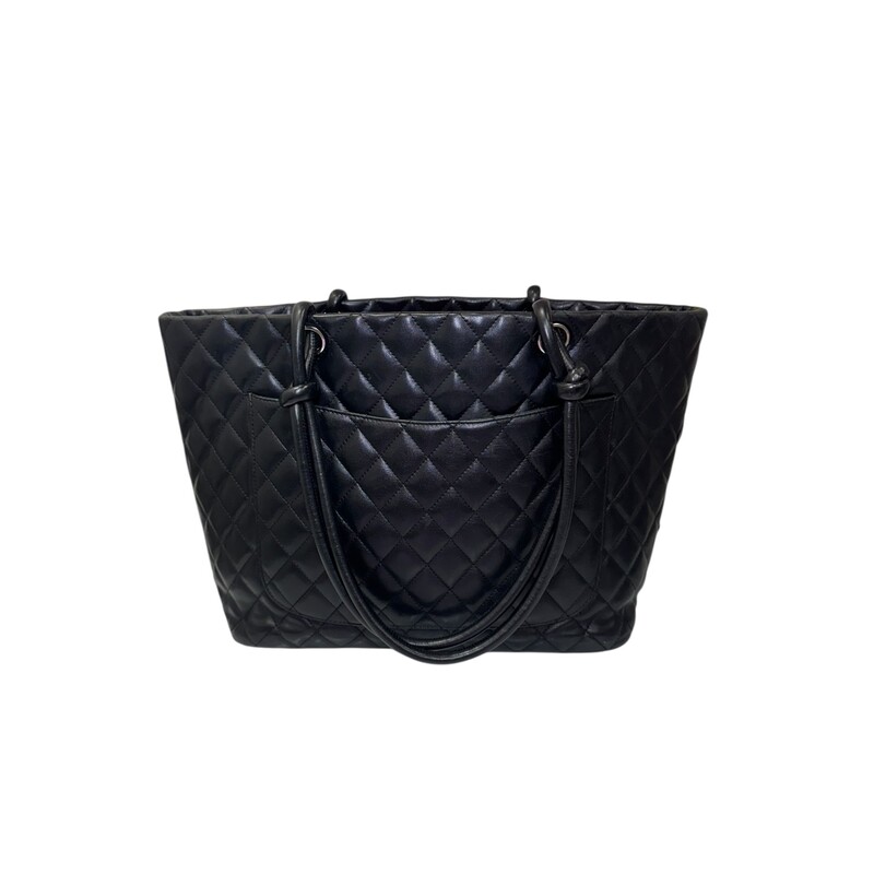 Chanel Cambone Leather Tote<br />
<br />
Serial Code: 10596778<br />
<br />
Dimensions:<br />
Base length: 11.75 in<br />
Height: 9.5 in<br />
Width: 5.75 in<br />
Drop: 8 in<br />
<br />
In very good condition. Some corner wear and interior marks.<br />
<br />
Does not come with original dust bag or box.