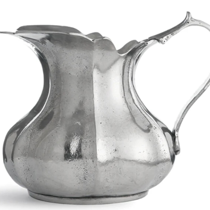 Arte Italica Scallop Pitcher
Pewter
Size: 7x5.5H  28 oz
Each one-of-a-kind pitcher is a marriage of the highest quality pewter combined with the talents of Italian artisans, using techniques passed down through generations. Italian pewter, Hand made in Italy.
Hand wash only. NEW Retail $315