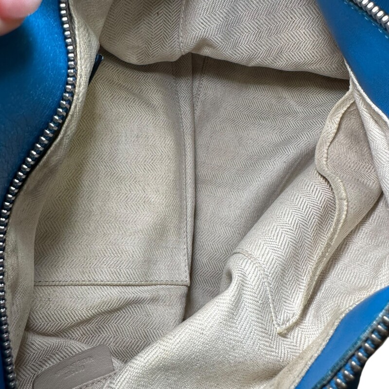 Loewe Puzzle Leather Blue Bag  Crossbody.<br />
<br />
Serial Code:011507<br />
<br />
Dimensions:12 L x 10 H inches<br />
<br />
In fair condition. Scratches and discoloration throughout the leather. Corner wear and interior marks.<br />
<br />
Does not come with original dust bag or box.