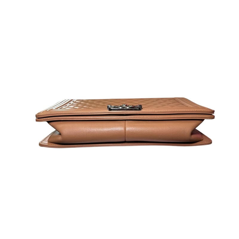 Chanel Boy Calfskin Large Tan<br />
<br />
Code: 20418***<br />
<br />
Dimensions.<br />
<br />
In good condition. Wear around the corners and throughout the bag. scratching to hardware. Major interior staining. Bag deformation on bottom from improper storage.<br />
<br />
Does not come with the original dust bag or box.