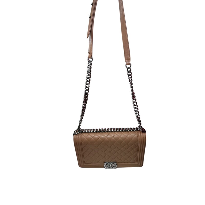 Chanel Boy Calfskin Large Tan<br />
<br />
Code: 20418***<br />
<br />
Dimensions.<br />
<br />
In good condition. Wear around the corners and throughout the bag. scratching to hardware. Major interior staining. Bag deformation on bottom from improper storage.<br />
<br />
Does not come with the original dust bag or box.