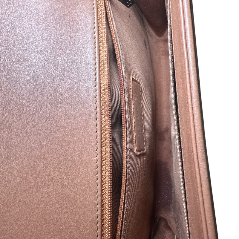 Chanel Boy Calfskin Large Tan<br />
<br />
Code: 20418***<br />
<br />
Dimensions.<br />
<br />
In good condition. Wear around the corners and throughout the bag. scratching to hardware. Major interior staining. Bag deformation on bottom from improper storage.<br />
<br />
Does not come with the original dust bag or box.