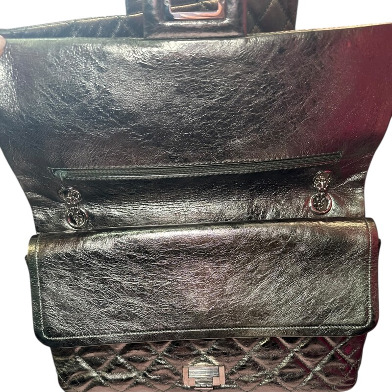Chanel Reissue 2.55 Metallic 227 Green Flap<br />
<br />
Code: 1200****<br />
<br />
Dimensions:<br />
12W x 8H x 4D<br />
10 handle drop<br />
18 strap drop<br />
<br />
In very good condition. Light wear throughout the bag.  Light scratching to hardware.<br />
<br />
Does not come with the original dust bag or box.