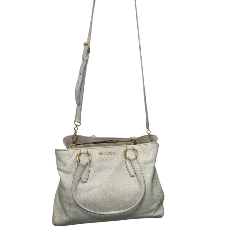 Miu Miu Vitello Daino Tote Pomice

Factory Code:158

Dimensions:
Base length: 12.50 in
Height: 9.25 in
Width: 5.50 in
Drop: 8.00 in
Drop: 20.00 in

In very good condition.  A few scuffs on the back and front of the bag.

Comes with the original dust bag. No box.