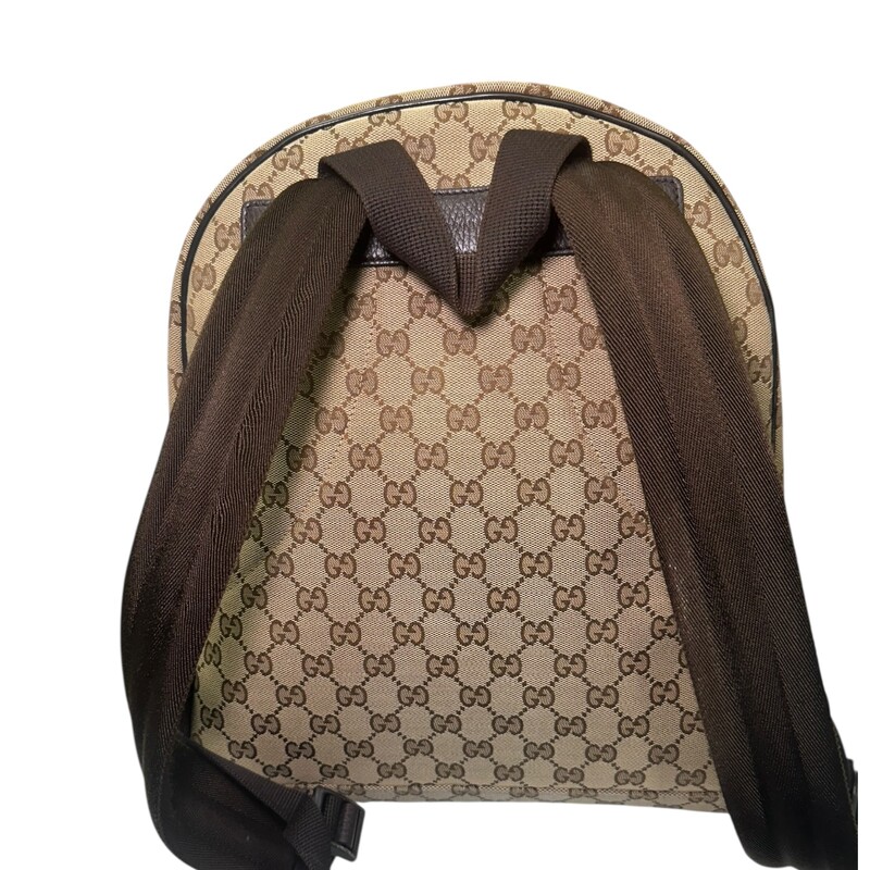 Gucci Travel Backpack Dark Brown Canvas<br />
<br />
Code: 449906 493075<br />
<br />
Dimensions:<br />
Base length: 12 in<br />
Height: 14.25 in<br />
Width: 5 in<br />
Drop: 3.5 in<br />
Drop: 14 in to 0.00 in<br />
<br />
In very good condition. Light wear to the hardware.<br />
<br />
Comes with the original dust bag. No box.