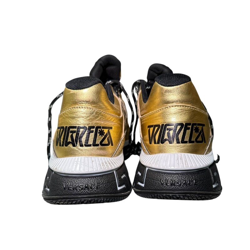 Versace Trigerca  Gold Sparkle Sneakers<br />
<br />
Size 42<br />
<br />
In good condition. Some scratches on the leather and some wear on bottoms.<br />
<br />
Does not come with original dust bag or box.