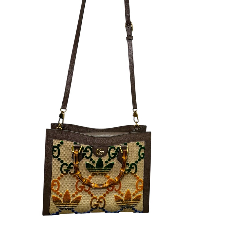 Gucci X Adidas Diana Mulitcolor Bamboo Tote<br />
<br />
Style Code:678842.520981<br />
<br />
Dimensions:13.5 L x 11 H inches<br />
<br />
In very good condition. This bag only includes one strap.Missing the second strap. Minor scratching on harware. Some interior marks.<br />
<br />
Does not come with original dust bag or box.