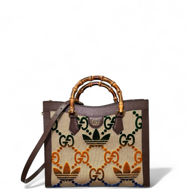 Gucci X Adidas Diana Mulitcolor Bamboo Tote<br />
<br />
Style Code:678842.520981<br />
<br />
Dimensions:13.5 L x 11 H inches<br />
<br />
In very good condition. This bag only includes one strap.Missing the second strap. Minor scratching on harware. Some interior marks.<br />
<br />
Does not come with original dust bag or box.