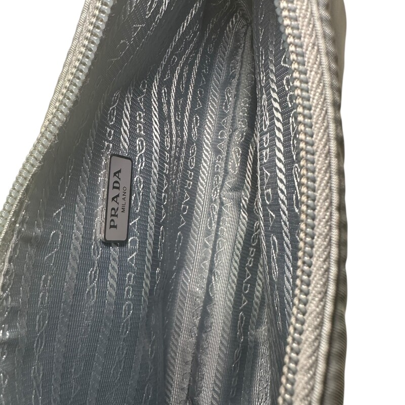 Prada Nylon Re Edition Nylon Bag<br />
<br />
Factory Code: 270<br />
<br />
Dimensions:<br />
Height: 17cm<br />
Width: 22cm<br />
Length: 6cm<br />
<br />
In good condition. Some marks throughout the nylon fabric. Stain on the bottom of the bag.<br />
<br />
Does not come with original dust bag or box.