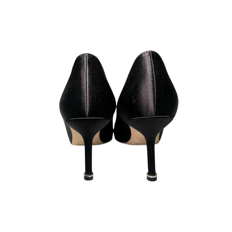 Manolo blahnik Hangisi Black Satin Heels<br />
<br />
Size 37.5<br />
<br />
In very good condition. Light wear on bottoms. Some marks on soles.<br />
<br />
Does not come with original dust bag or box.