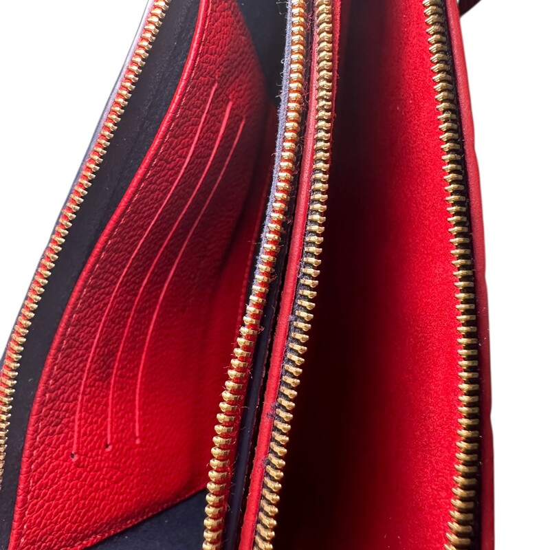 Louis Vuitton Double Zip Marine Rouge Empreinte<br />
Pochette Chain Crossbody<br />
<br />
Red/Navy<br />
<br />
Date Code: Microchip<br />
<br />
Dimensions: Dimensions: 8.5 L  x 5.1 H  x 1.0 W inches<br />
                          Handle Drop: 21.5 inches<br />
<br />
Does not come with original dust bag or box.