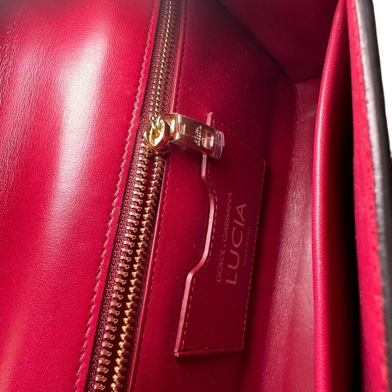 Dolce & Gabbana Lucia, Python Top Handle Bag<br />
<br />
Dimensions:6.5 H x 9.5 W  inches<br />
<br />
In very good condition. Some scratching of the hardware.<br />
<br />
Does not come with original dust bag or box.