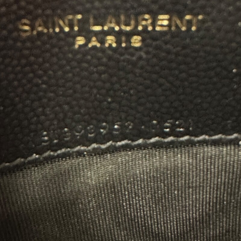 Saint Laurent Grained Leather Cassandre Woc<br />
<br />
Style number: YBL393953.0521<br />
<br />
Dimensions:7.5 L  x 5 H inches<br />
<br />
In very good condition. Scratching of the hardware.<br />
<br />
Comes with the original dust bag and box.
