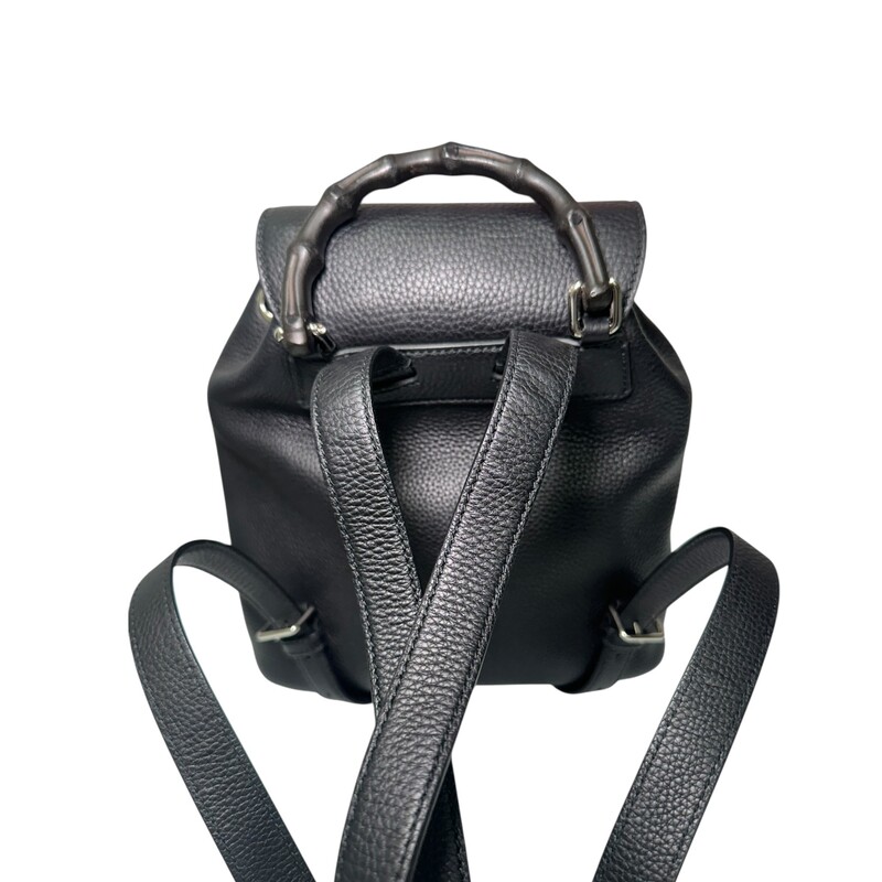 Gucci Bamboo Black Leather Backpack<br />
<br />
Style Code: 387149 .204990<br />
<br />
<br />
Dimensions:9.5 W x 10.5 H x 4 D inches<br />
<br />
In very good condition. Minor wear on the leather buckle.<br />
<br />
Comes with original dust bag. No box.