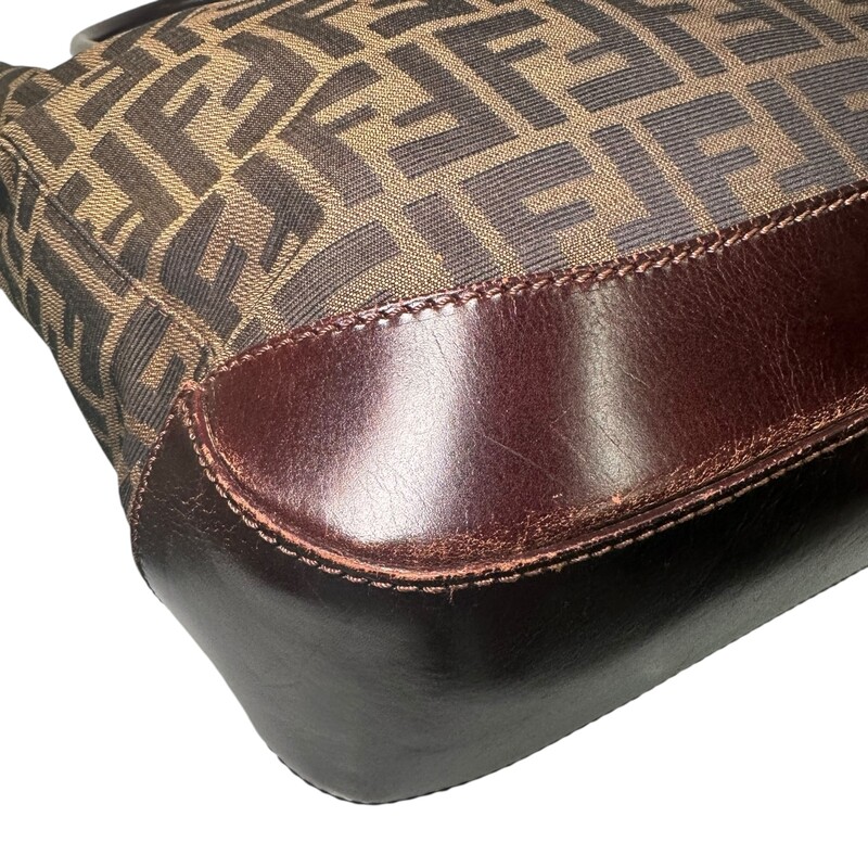 Fendi Zucca Logo Tote<br />
<br />
Serial Code: 71-16328-0--012<br />
<br />
Dimensions: 14L x 11H inches<br />
<br />
In very good condition. Some scratches on the leather strap and leather bottom.<br />
<br />
Does not come with original dust bag or box.