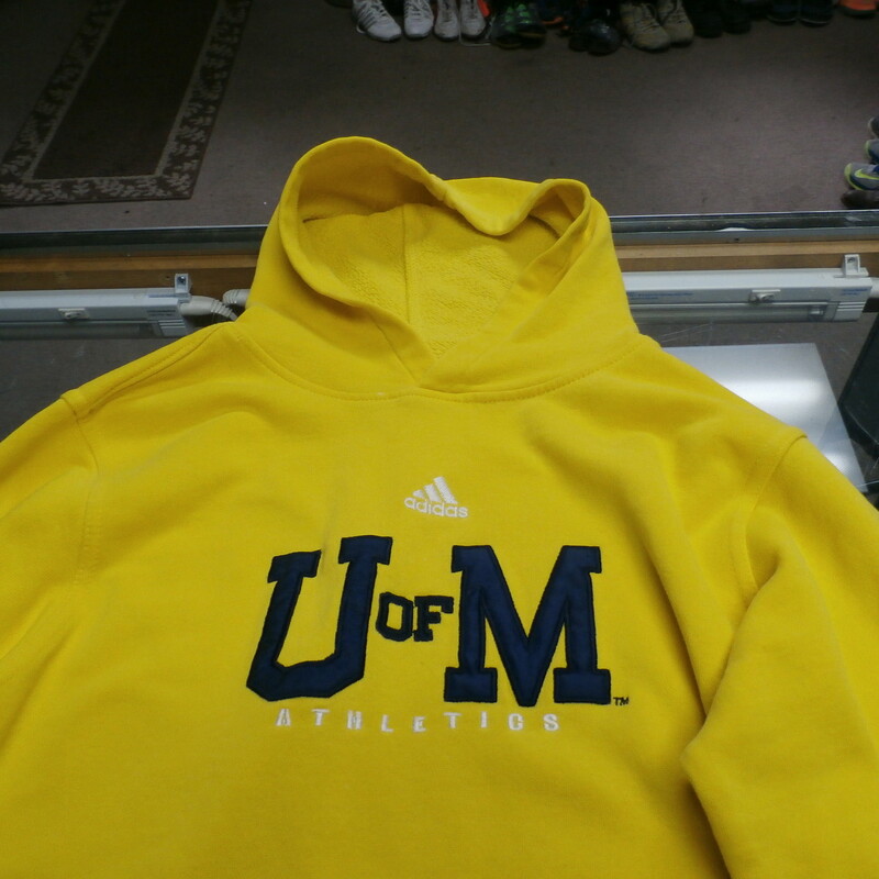 Michigan Wolverines adidas Adult Hooded Sweatshirt Missing Tag(Small?) #15420
Rating:   (see below) 4 - Fair Condition 
Team: Michigan Wolverines
Player: n/a
Brand: adidas
Size: Missing Tag(SMALL?) - Adult(Measured Flat: Across chest 20\", length 29\")
Measured flat: arm pit to arm pit; top of shoulder to the hem
Color: Yellow 
Style: embroidered hooded sweatshirt
Material: missing tag
Condition: - Fair Condition - wrinkled; few small bleach stains; small hole on the pocket; hole on the left sleeve near the left shoulder; stains on the back of the right sleeve; few stains on the bottom of the front; missing size and material tag; signs of use(PLEASE SEE PHOTOS)
Item #: 15412
Shipping: $4.76