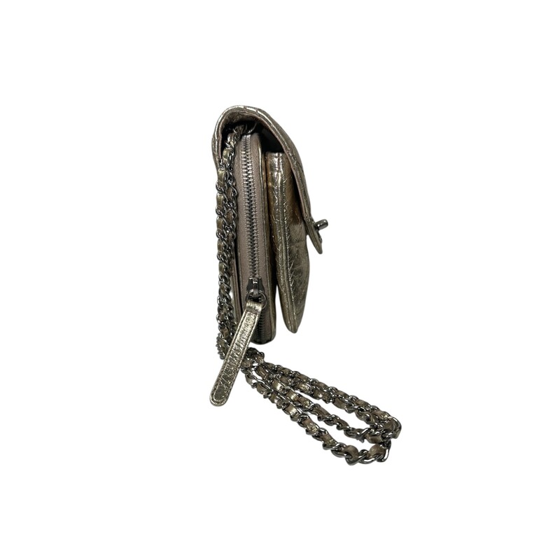 Chanel Clams Metallic Wallet On A Chain<br />
<br />
Serial Code: 16247070<br />
<br />
Dimensions:<br />
Height: 6 x Width: 5.5 xDepth: 1.75 inches<br />
<br />
In very good condition. Minor scratching on hardware.<br />
<br />
Doe not come with original dust bag or box.