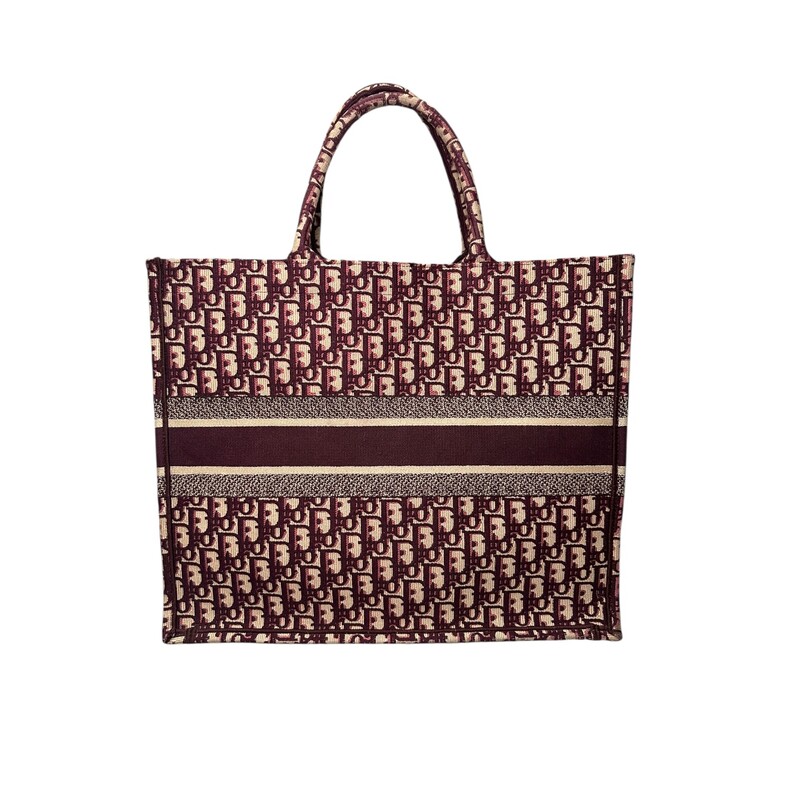 Dior Oblique Book BurgundyTote<br />
<br />
Date Code:50-MA-0168<br />
<br />
Dimensions: 17 L x 13 H inches<br />
<br />
In very good condition. Some minor corner wear.<br />
<br />
Does not come with original dust bag or box.