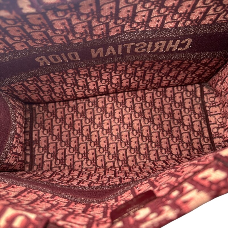 Dior Oblique Book BurgundyTote<br />
<br />
Date Code:50-MA-0168<br />
<br />
Dimensions: 17 L x 13 H inches<br />
<br />
In very good condition. Some minor corner wear.<br />
<br />
Does not come with original dust bag or box.