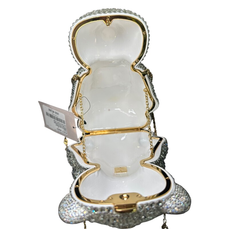 Gucci Teddy Bear Minaudière Handbags<br />
<br />
In excellent condition. New with the tag.<br />
<br />
Comes with the original dust bag and box.<br />
<br />
The GG style minaudière, shaped like a teddy bear, features silver-toned and black brass, adorned with hand-applied clear and black crystals. This version showcases resin eyes that gleam in a rich brown. Enhancing its luxurious appeal, a gold-toned Interlocking G chain strap complements the bag. The inside offers room for essentials, presented in a refined creamy-white shade.
