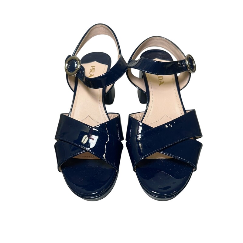 Prada Crisscross Patent Navy<br />
<br />
Size: 37<br />
<br />
In excellent condition.<br />
<br />
Does not come with the original dust bag or box.