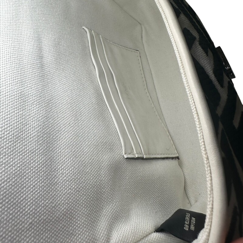 Fendi Zucca Baguette Canvas New Model Crossbody<br />
<br />
Serial Code:8BS017 A JQY 238 4095<br />
<br />
Dimensions:7 L X 5 H inches<br />
<br />
In very good condition.Some discoloration of the canvas. Small scratches of the canvas. Some scratches on the hardware.<br />
<br />
Comes with original dust bag. No box