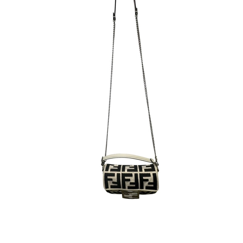 Fendi Zucca Baguette Canvas New Model Crossbody<br />
<br />
Serial Code:8BS017 A JQY 238 4095<br />
<br />
Dimensions:7 L X 5 H inches<br />
<br />
In very good condition.Some discoloration of the canvas. Small scratches of the canvas. Some scratches on the hardware.<br />
<br />
Comes with original dust bag. No box