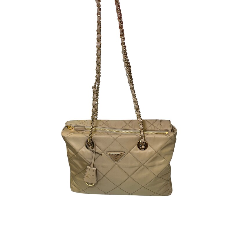 Prada Re Edition 1995 Nylon Desert Beige Chaine Tote<br />
<br />
Factory Code: 272 G<br />
<br />
Dimensions: 12 L x 8 H inches<br />
<br />
In excellent condition. Like new.<br />
<br />
Comes with the original dust bag. No box.