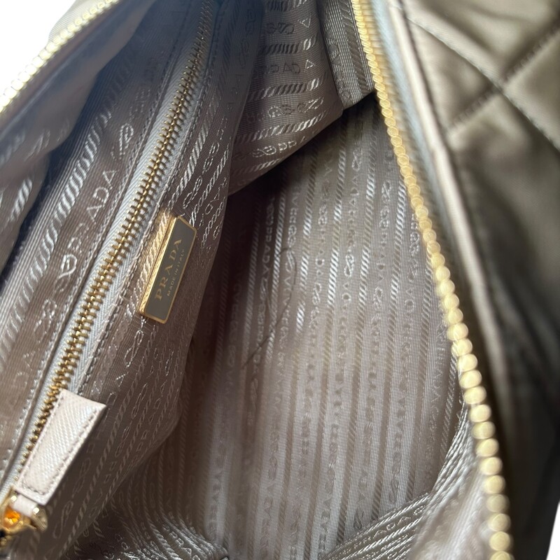 Prada Re Edition 1995 Nylon Desert Beige Chaine Tote<br />
<br />
Factory Code: 272 G<br />
<br />
Dimensions: 12 L x 8 H inches<br />
<br />
In excellent condition. Like new.<br />
<br />
Comes with the original dust bag. No box.