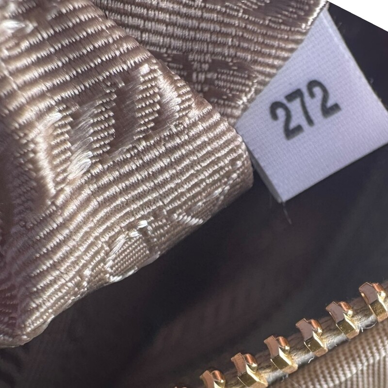 Prada Re Edition 1995 Nylon Desert Beige Chaine Tote<br />
<br />
Factory Code: 272 G<br />
<br />
Dimensions: 12 L x 8 H inches<br />
<br />
In excellent condition. Like new.<br />
<br />
Comes with the original dust bag. No box.