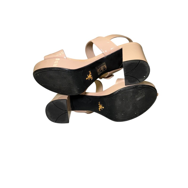 Prada Block Sling Tan Patent<br />
<br />
Size: 37<br />
<br />
In very good condtion. Light scuffs to the front of the leather.<br />
<br />
Does not come with the original dust bag or box.