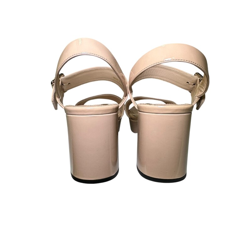 Prada Block Sling Tan Patent<br />
<br />
Size: 37<br />
<br />
In very good condtion. Light scuffs to the front of the leather.<br />
<br />
Does not come with the original dust bag or box.