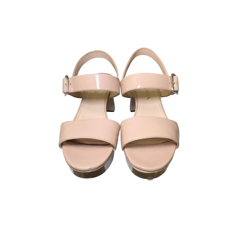 Prada Block Sling Tan Patent<br />
<br />
Size: 37<br />
<br />
In very good condtion. Light scuffs to the front of the leather.<br />
<br />
Does not come with the original dust bag or box.