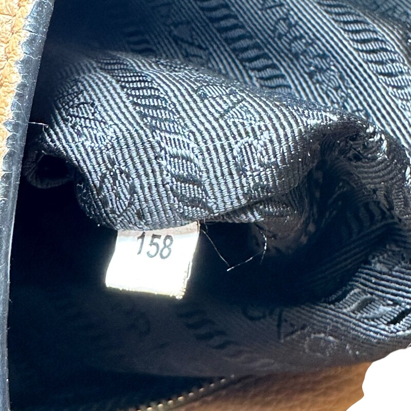 Prada Vitello Phenix Brown Hobo with Double Strap

Date Code: 158

Dimensions: 12 L x 13 H inches

In very good condition. Some discoloration of hardware. Some corner wear and some wear to the strap.

Come with original dust bag. No box.