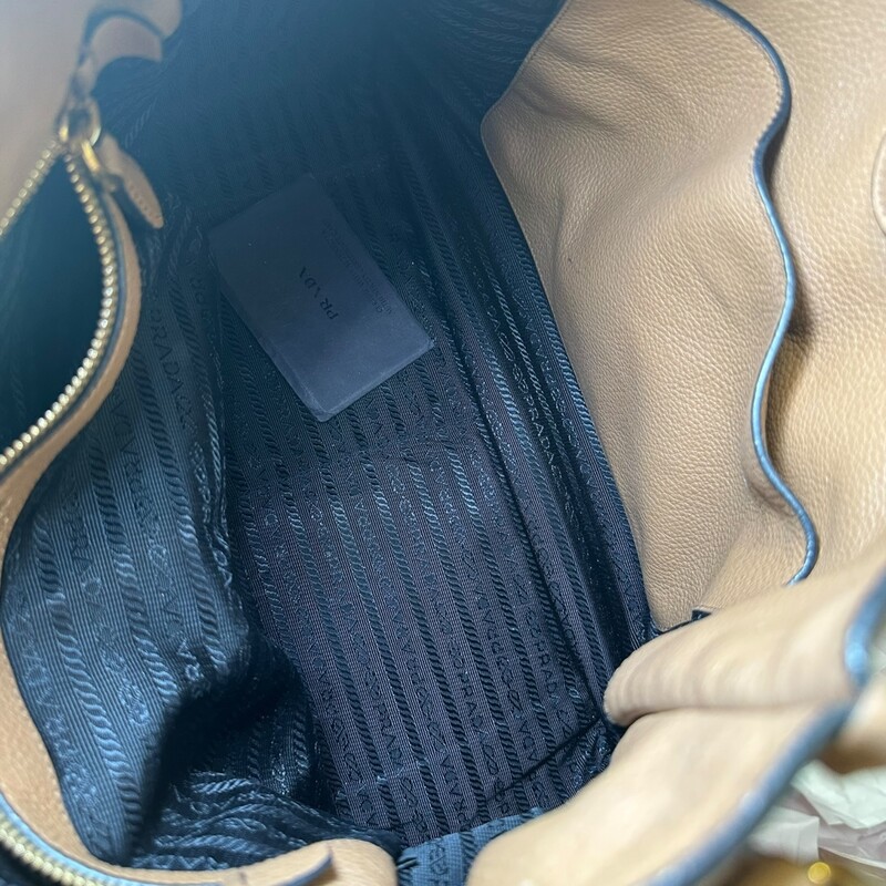 Prada Vitello Phenix Brown Hobo with Double Strap<br />
<br />
Date Code: 158<br />
<br />
Dimensions: 12 L x 13 H inches<br />
<br />
In very good condition. Some discoloration of hardware. Some corner wear and some wear to the strap.<br />
<br />
Come with original dust bag. No box.