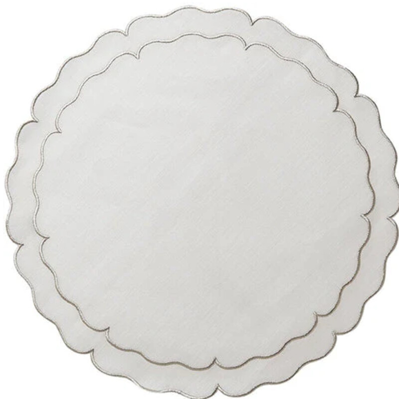 Skyros Scalloped Round Mats
White Linen with Silver Trim
Size: 19x15
Set of 4
NEW Retail $140+
These exquisite mats are Made in Portugal of 100% pure linen and treated with a light acrylic coating. Caring for the Linho Collection mats is quite easy. Simply wipe a spill clean with a damp cloth! It’s just that effortless, as the mats are extremely stain resistant. Linho mats are designed to add a beautiful monogram, either at the top or center, but are just as exquisite without one.