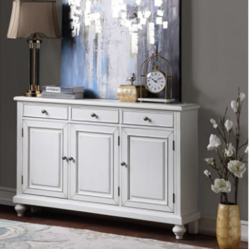3 Door 3 Drawer Wood Console
Cream Wood
Size: 56 x 11 x 35H
NEW Retail $675
Three panel style doors open to reveal a spacious shelved interior, and are topped by three deep drawers on this enchanting Credenza.