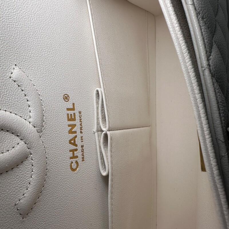 Chanel Double Flap White Veau Leather Chain Bag<br />
<br />
Serial Code TEK*****<br />
<br />
Dimensions: 9 L x 5.7 H inches<br />
<br />
In excellent condition. Like New.<br />
<br />
Comes with the original dust bag and box.