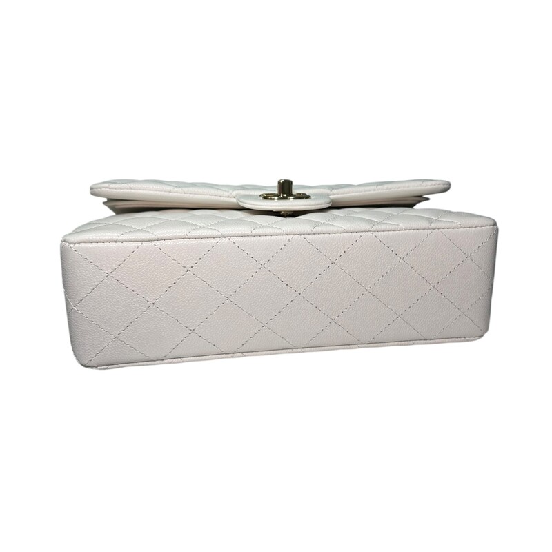 Chanel Double Flap White Veau Leather Chain Bag<br />
<br />
Serial Code TEK*****<br />
<br />
Dimensions: 9 L x 5.7 H inches<br />
<br />
In excellent condition. Like New.<br />
<br />
Comes with the original dust bag and box.